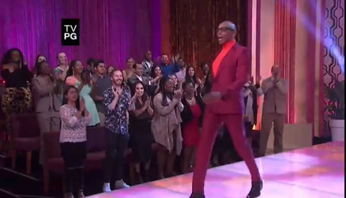 RuPaul walking down a catwalk