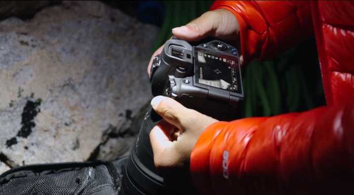 Jimmy Chin adjusting camera settings