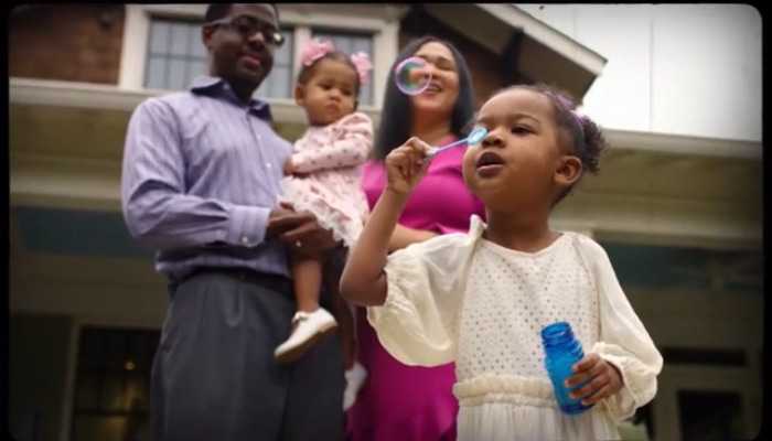 Family in front of a house