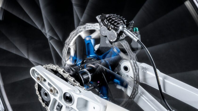 Close-up image showcasing the dynamic movement of a bicycle disk brake system in high detail.