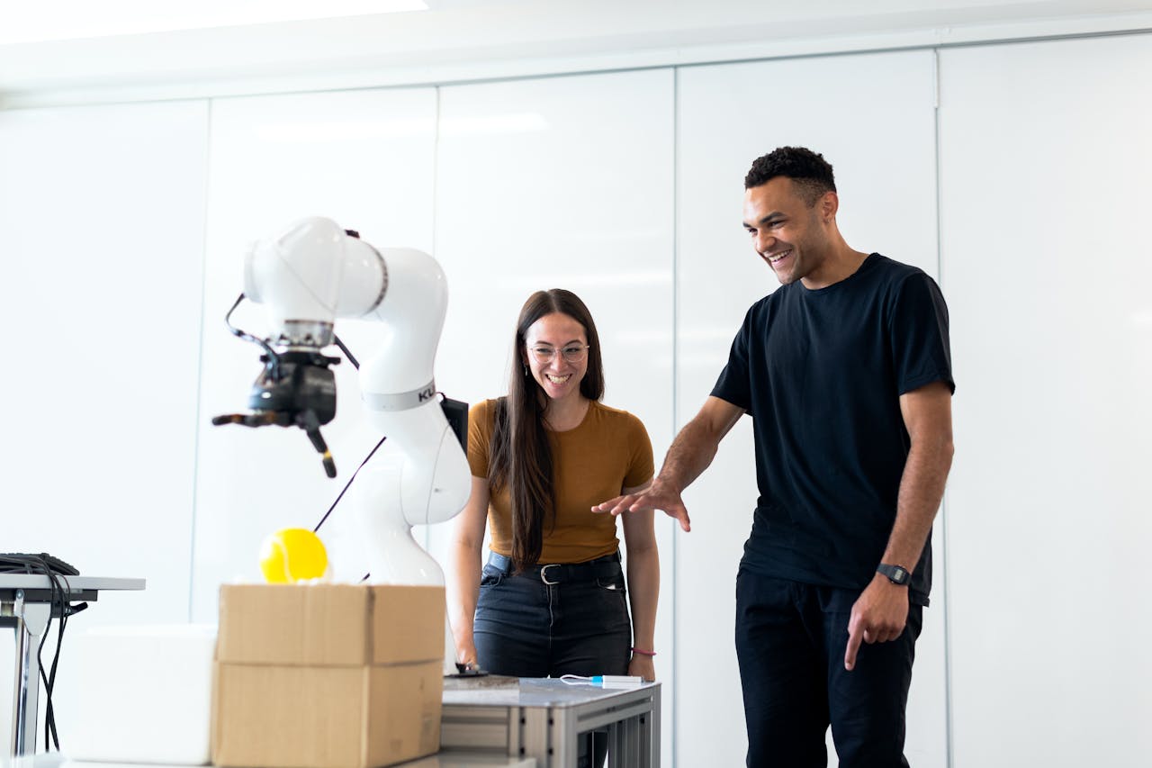 Engineers developing a robotic arm