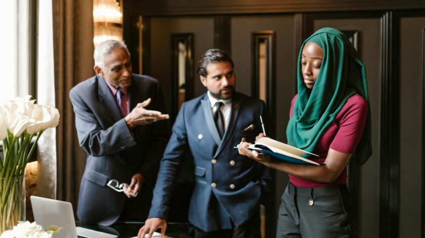 Business professionals discussing a project indoors, capturing a collaborative environment.